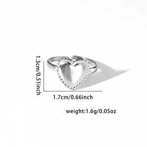 Detail view of silver heart ring with beaded edges showing dimensions 1.3cm and 1.7cm