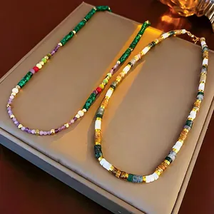 Bohemian beaded necklaces with green and brown beads on a leather jewelry box