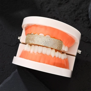 Iced out gold hip hop grillz for men featuring rows of sparkling clear zircons