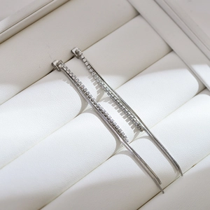 Silver plated geometric tassel earrings with pavé zircons and long snake chain fringes
