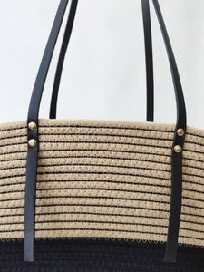 Classic summer woven beach tote bag with black stripes and sturdy leather handles