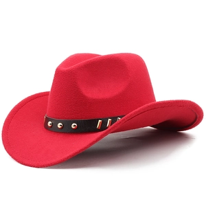 Detail of red wool felt cowboy hat featuring a black leather band with gold metal studs