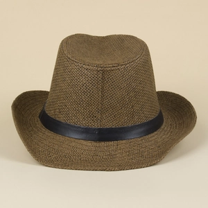 Detail of brown woven straw jazz hat featuring a black faux leather decorative band