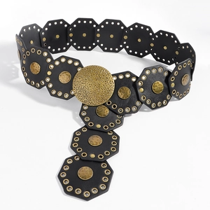 Close-up of vintage black leather wide belt with octagonal segments and metal discs
