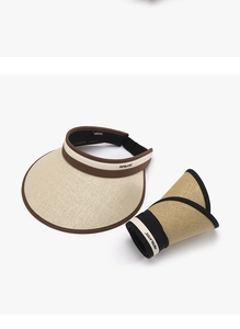 Detail of foldable natural straw sun visor showing both expanded and rolled storage state