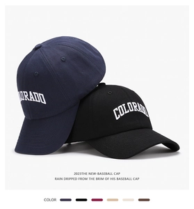 Detail view of cotton baseball caps with Colorado embroidery in various color options