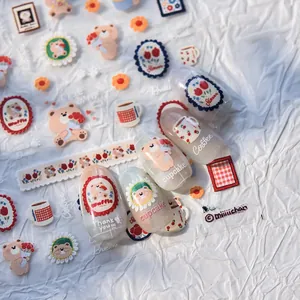 Detail of ultra-thin Korean nail art stickers featuring cute bears and tulip designs