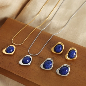 Vintage gold and silver jewelry set with irregular blue natural stone pendants and earrings