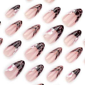 French leopard print press-on nails with floral accents and black V-shape stripes