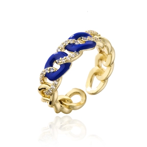 Detail of 18K gold-plated chain ring with blue enamel and zircon paving on white background