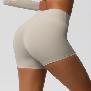 Close-up of high-waisted beige yoga shorts showing seamless scrunch butt texture