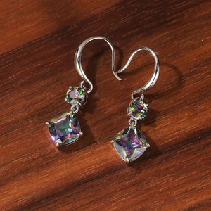Detail of silver drop earrings featuring colorful square and round faceted gemstones