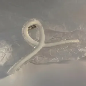 Minimalist large creamy white hair claw clip with streamlined resin design for women