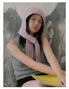 Detailed knit texture of pink balaclava with warm integrated winter hood and scarf