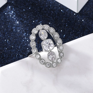 Macro shot of luxury silver vintage ring with oval hollow design and zircon pavé