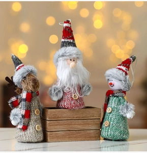 Close-up of knit Christmas plush ornaments featuring Santa, Snowman and Reindeer