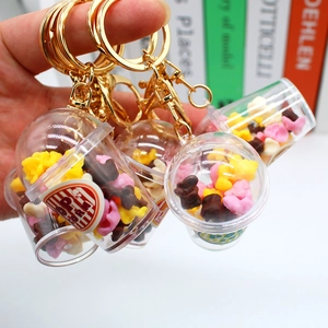 Miniature popcorn bucket keychain with colorful kernels and golden metal ring