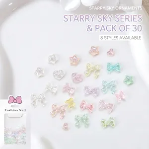 30pcs aurora resin nail art charms with glittery stars hearts and bows on white tray