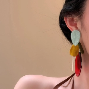 Bohemian multicolored acrylic teardrop dangle earrings with marble texture on model
