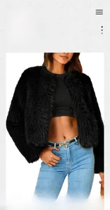 Close-up of black faux fur jacket texture with plush finish for autumn and winter style