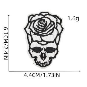 Detail view showing dimensions of a skull and rose embroidered patch in black and white