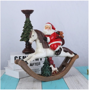 Resin Santa Claus on white rocking horse Christmas decoration with tree candle holder