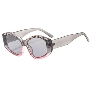 Stylish irregular hexagonal sunglasses with two-tone tortoiseshell and pink frames