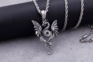 Detailed macro shot of silver stainless steel mechanical punk dragon pendant with rope chain