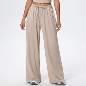 Detail of high-waist elastic drawstring on beige wide-leg lounge pants for women