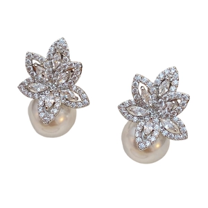 Elegant floral pearl drop earrings featuring cubic zirconia petals and white pearls