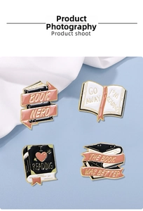 Close-up of four enamel book lover pins including Book Nerd and Book Was Better motifs