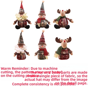 Detail of Christmas plush figurines showing plaid fabric patterns and festive accessories
