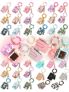 Variety of floral and leopard print silicone beaded wristlet keychain card holders