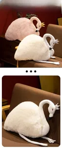 Detailed view of white plush swan toy with sequins crown and soft faux fur texture