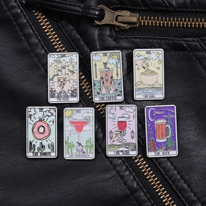 Detail view of 7 creative tarot-style food and drink enamel pins on a black leather jacket