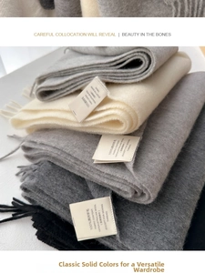 Close-up of 100% Australian wool scarf label showcasing soft knit texture and fringe