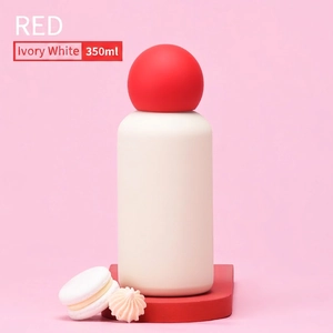 Close-up of ivory white 350ml vacuum flask with creative red spherical lid design