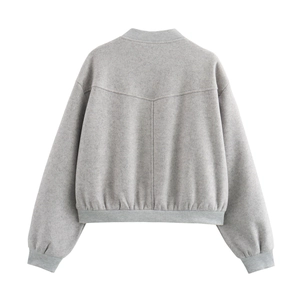 Detailed back view of a grey tweed jacket showing fabric texture and ribbed hem