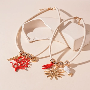 Nautical style necklace set with coral lobster sun and shell charms on leather cord