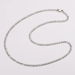 Detail of silver Figaro chain necklace with high-polished links and a lobster clasp