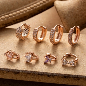 Lot de huit boucles d'oreilles cartilage en or rose avec breloques en zircone cubique