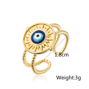 Detailed view of gold plated evil eye ring with 1.8cm diameter and enamel sunburst design
