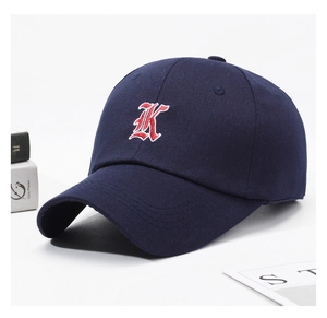 Detail of navy cotton baseball cap featuring high-quality 3D gothic letter K embroidery