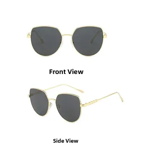 Detail view showing golden metal frame and geometric texture on the temple of cat eye sunglasses