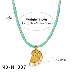 Detail of gold shell pendant with white pearls and rhinestones on turquoise braided rope