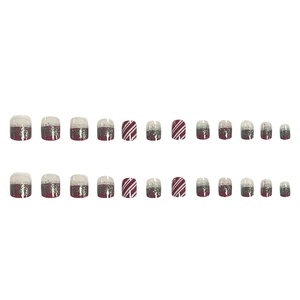 Christmas press-on nails set with red glitter gradient and striped festive patterns