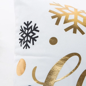 Modern white Christmas pillow case with metallic gold snowflake and black foil patterns