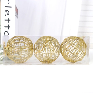 Three gold hollow mesh Christmas ball ornaments with glitter in a clear plastic display box