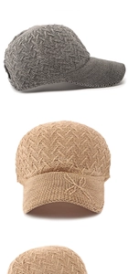 Detailed close-up of woven mesh texture and dragonfly knit decor on breathable sun caps
