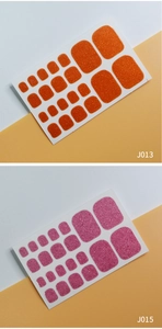 Detail view of J013 orange and J015 pink glitter solid color toe nail wrap stickers